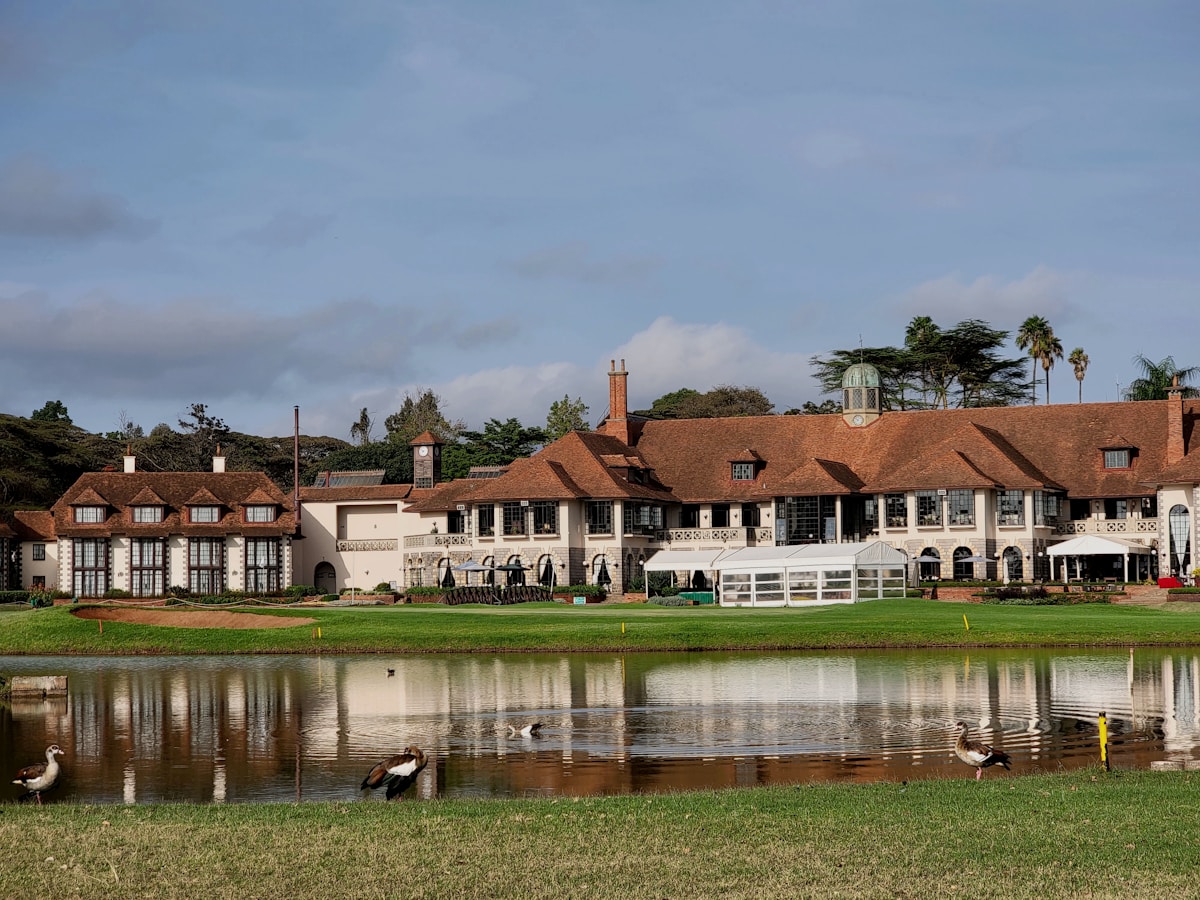Colonial-style hotel building with pond, Nairobi Kenya