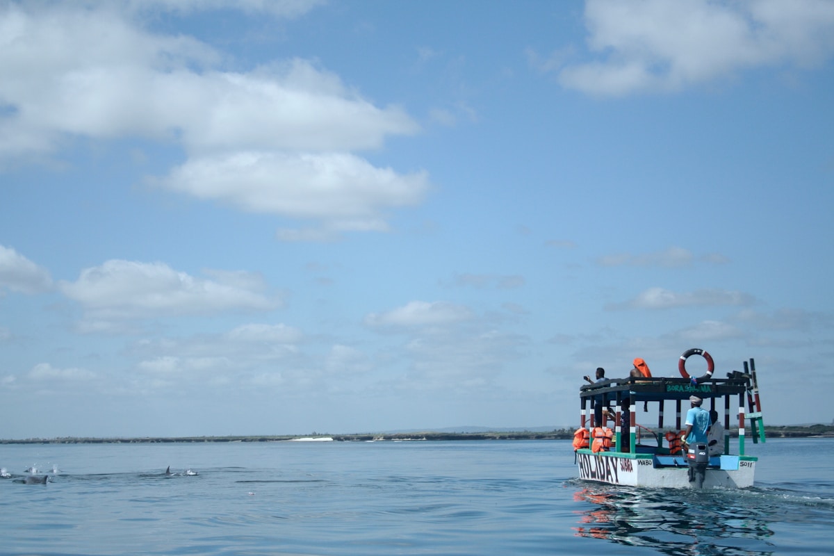 A glass-bottomed tour boat at Watamu watching dolphins in the Indian Ocean, Kenya