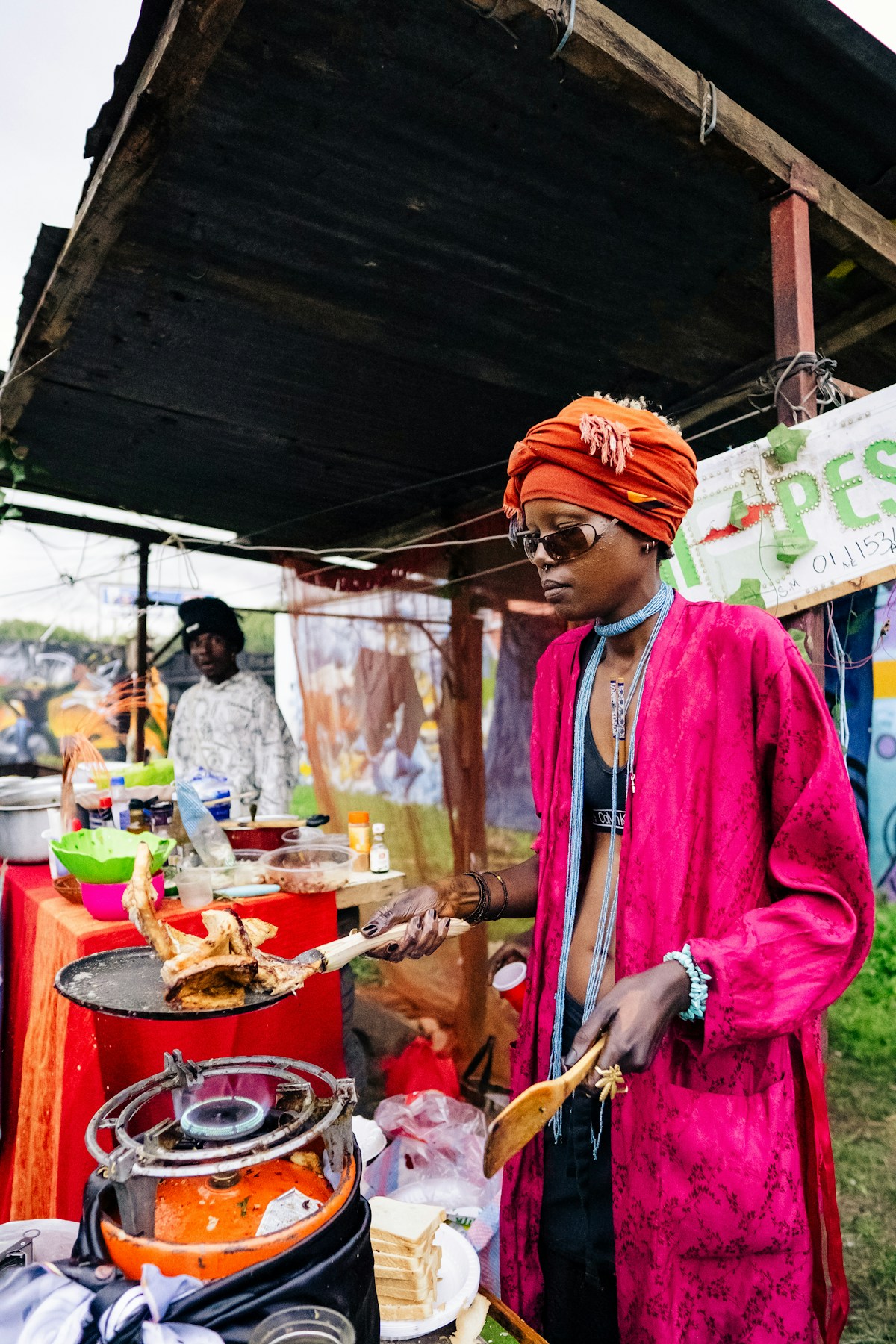 Street food vendor cooking at an outdoor stall in Nairobi, Kenya