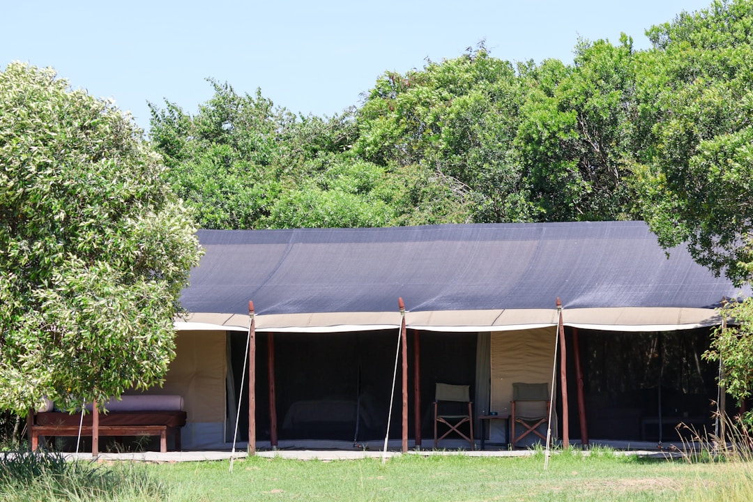 Luxury safari tented camp in the Kenya savannah with canvas walls and veranda