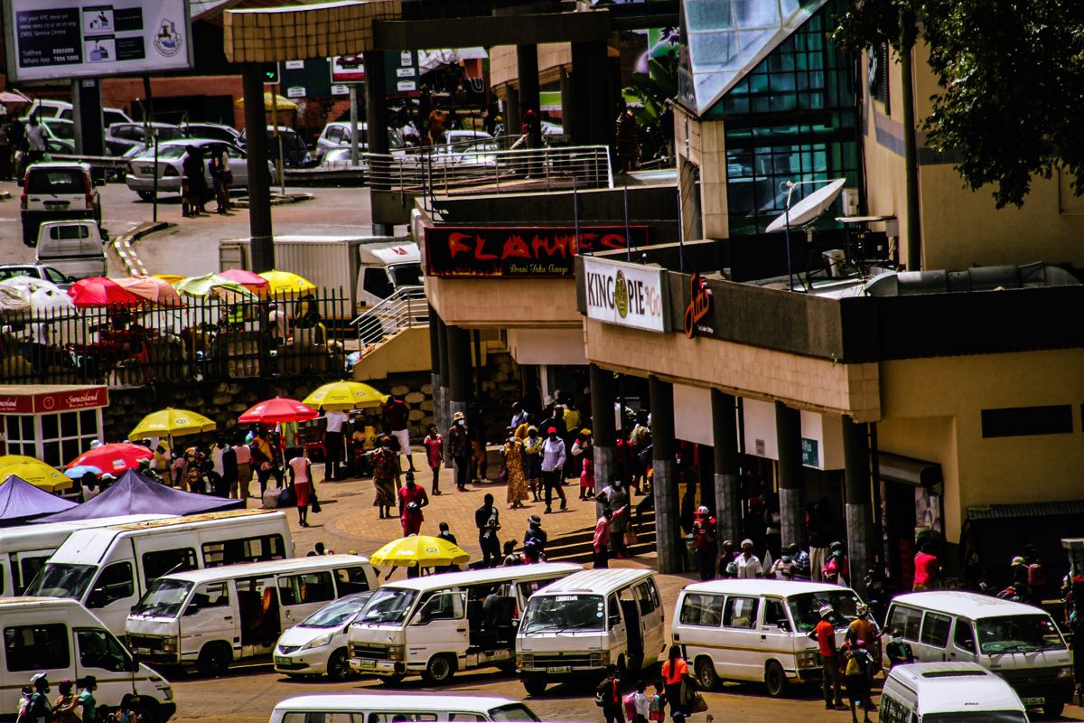 Nairobi city traffic and modern buildings viewed from a safe tourist area