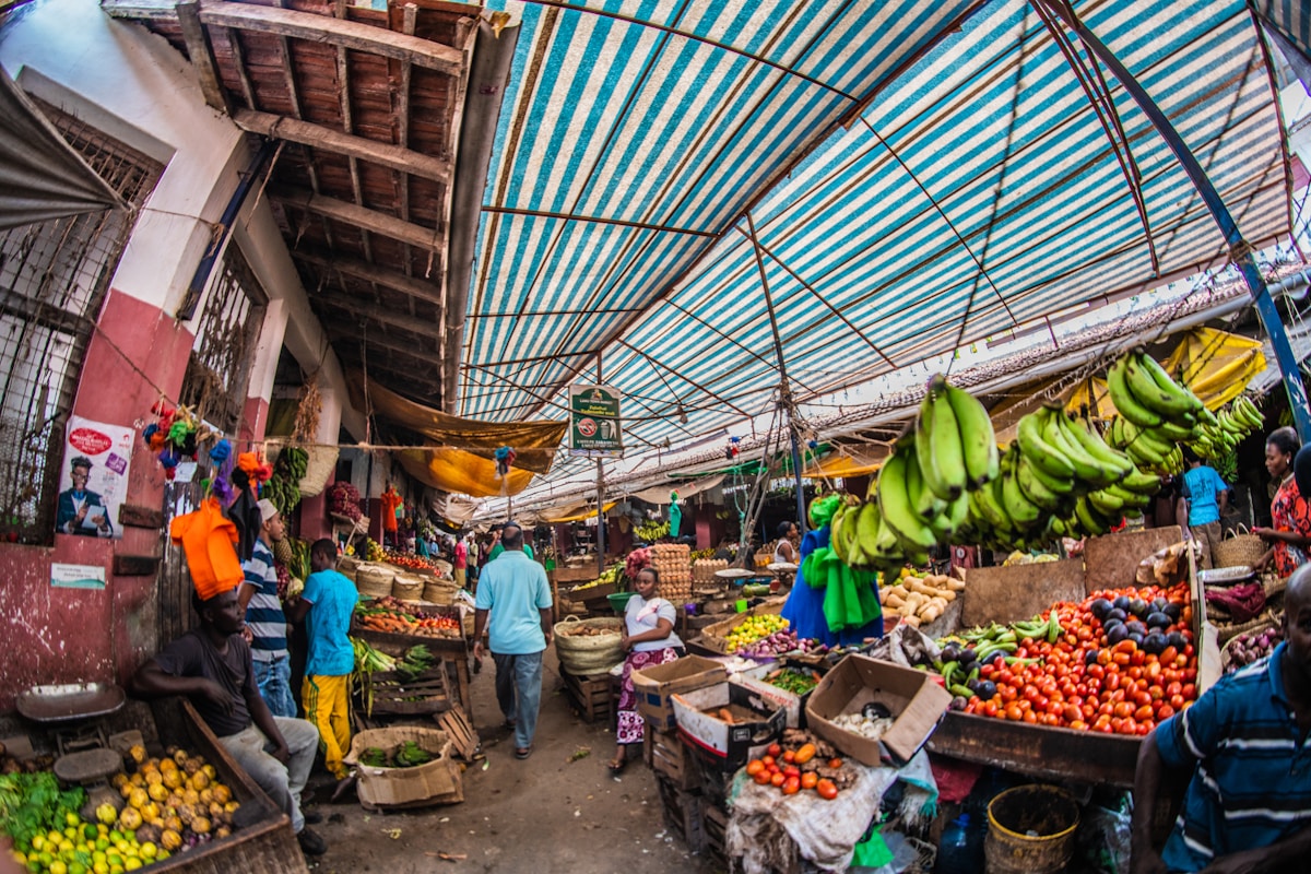 Busy covered market in Lamu with fruit and vegetable stalls, Kenya